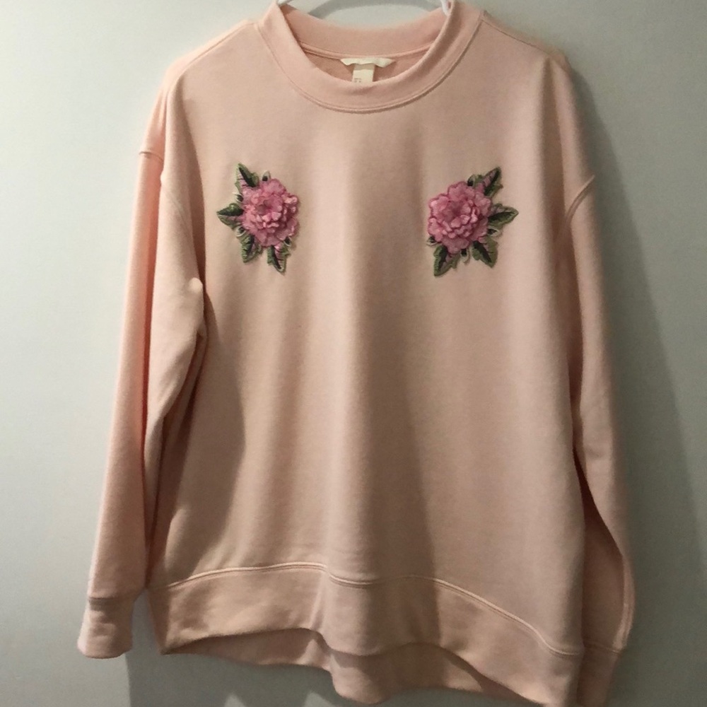 Pink sweater with floral patches